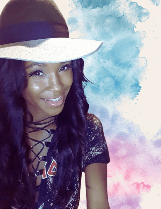 Woman wearing a wide-brimmed hat with a colorful, abstract background