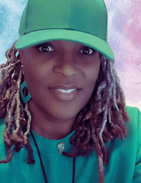 Person wearing a green cap and teal shirt with a colorful background